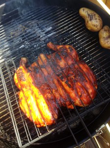 Butterflied chicken over indirect heat with mesquite smoke