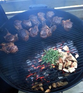 Grilling and smoking lamb chops with rosemary and hickory smoke